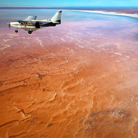 Arid red and salt white plains stretching into the distance